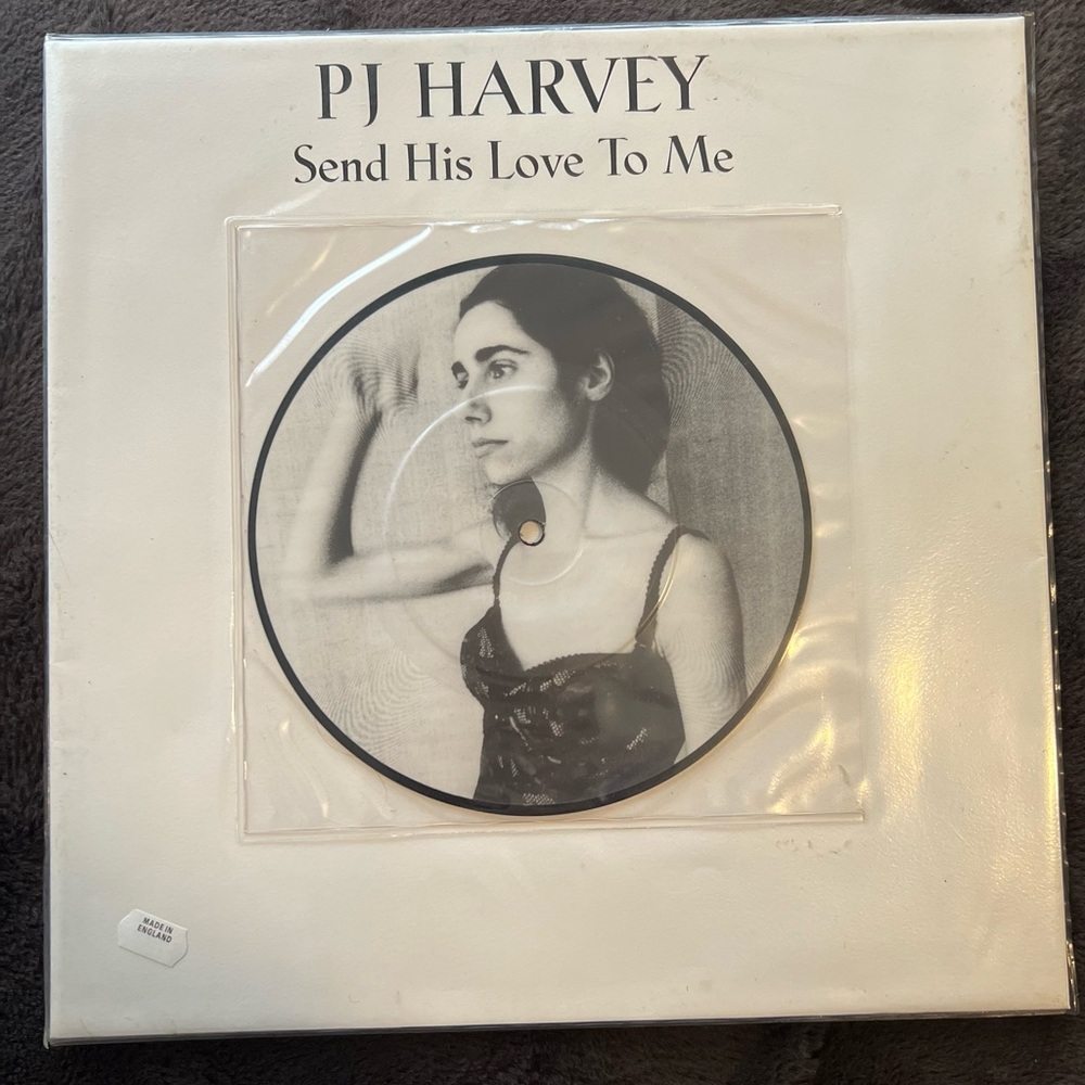 PJ HARVEY SEND HIS LOVE TO ME 7" PIC DISC IN 12" POSTER PACK LP
EU 1995 Island